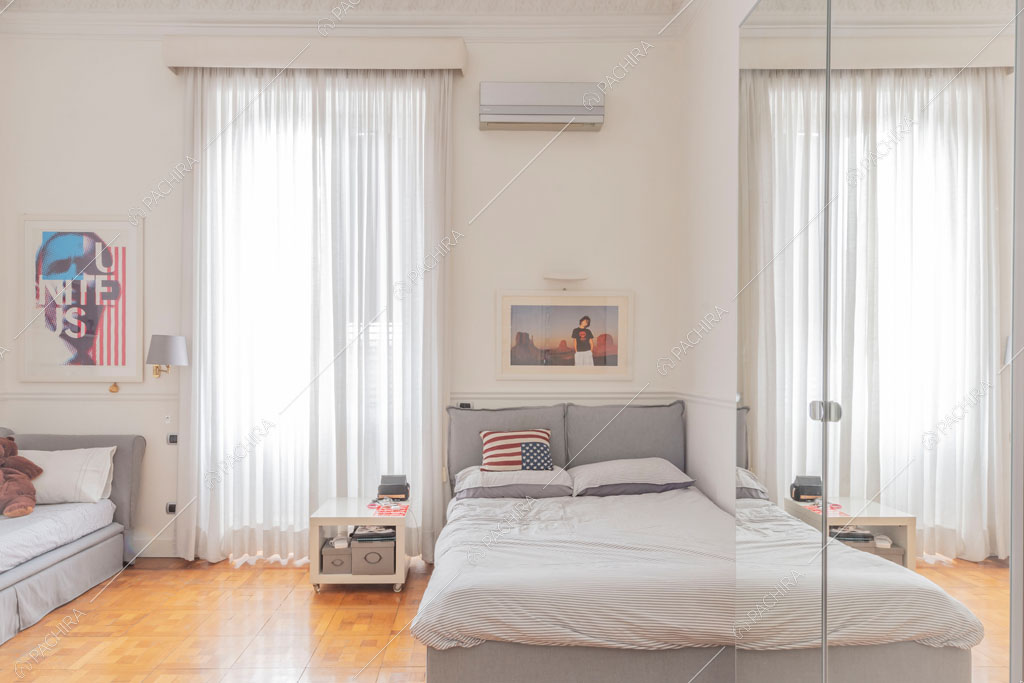 Camera da letto dell'appartamento Kiwano, location in stile moderno a Roma