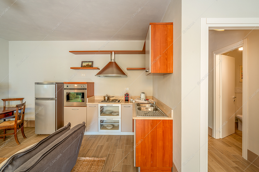 Cucina a vista dell'agriturismo Tevere, location in stile country a Siena