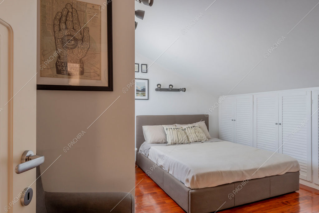 Camera da letto della villa Lena, location in stile moderno a Roma
