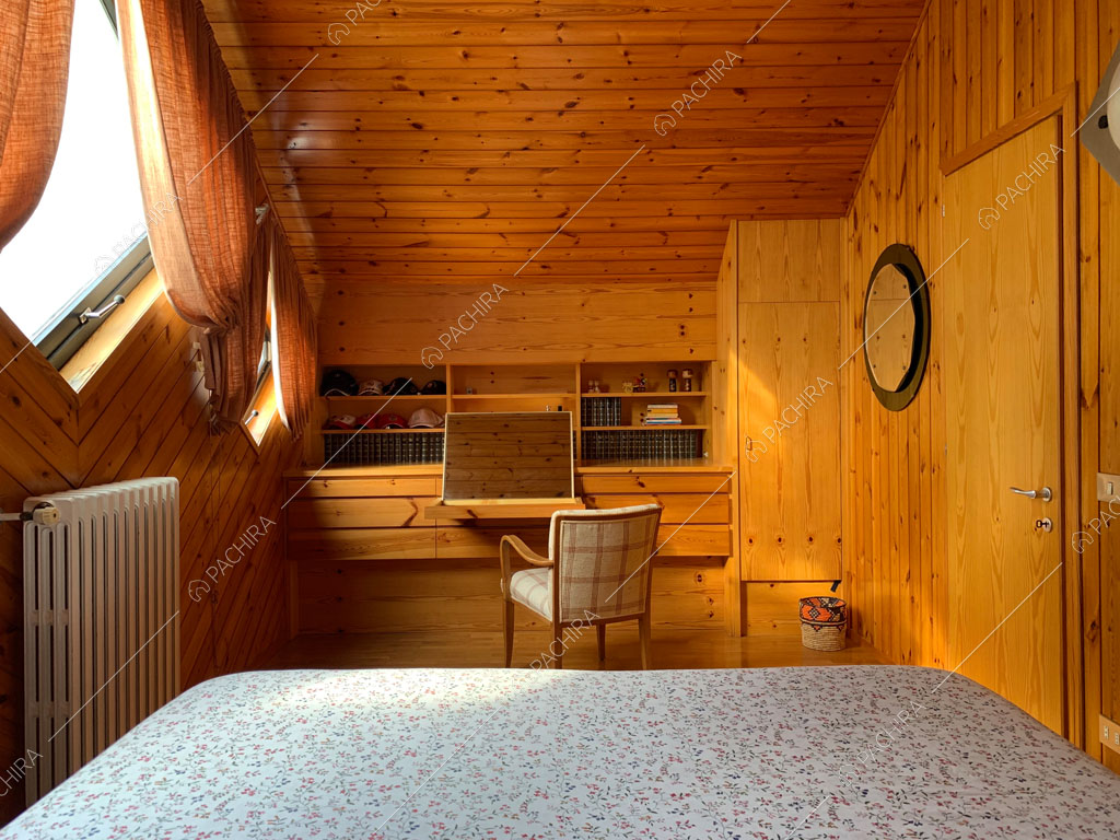 Camera da letto dello chalet Bulbine, location in stile moderno a Belluno